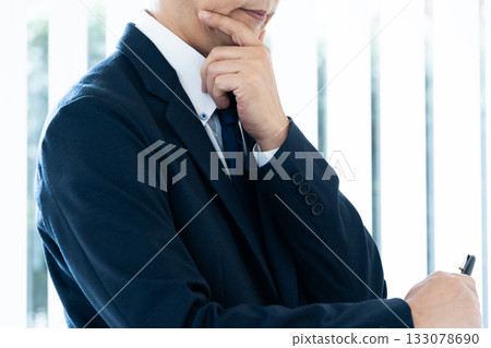 Businessman with arms folded 133078690