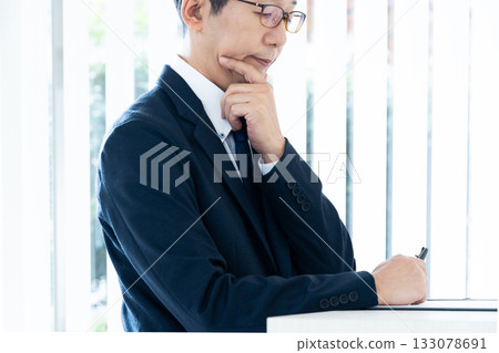 Businessman with arms folded Businessman with arms folded 133078691