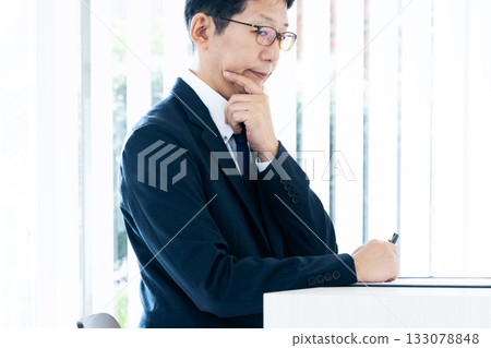thinking businessman thinking businessman 133078848