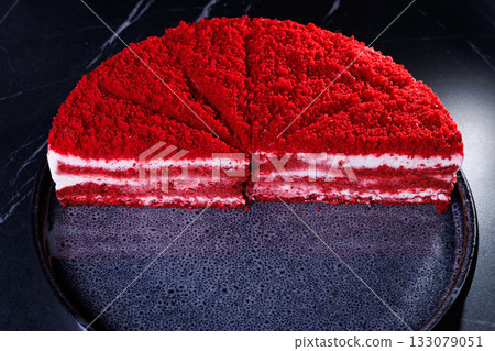 Red velvet cake, classic three layered cake from red butter sponge cakes with cream cheese frosting Red velvet cake, classic three layered cake from red butter sponge cakes with cream cheese frosting 133079051