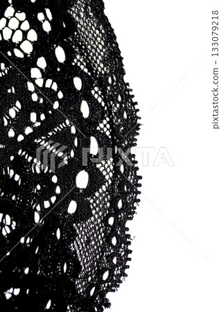 Close up of pretty crochet lace on a white background 133079218