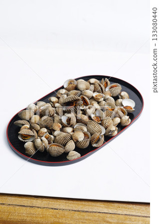 Small Clam Shells or called kerang darah in Asia On Black Plate Create Coastal Seafood Display For Food Styling Small Clam Shells or called kerang darah in Asia On Black Plate Create Coastal Seafood Display For Food Styling 133080440