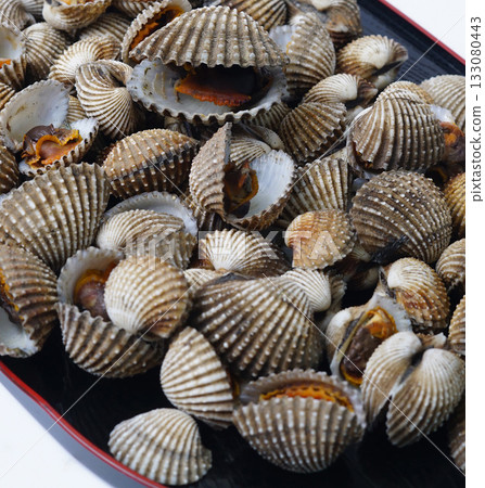 Small Clam Shells or called kerang darah in Asia On Black Plate Create Coastal Seafood Display For Food Styling 133080443