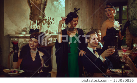 Stylish vintage friends toasting in glamorous evening atmosphere 133080836