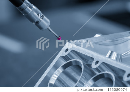 The multi axis CMM machine measuring the aluminum cylinder block parts. 133080974