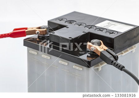 Incorrect Car Battery Jumper Cables Connection, Red on Negative and Black on Positive Terminal. Common Mistake. 133081916