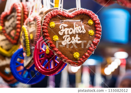 Close up of hanging gingerbread hearts with festive German greetings Happy Holiday A festive symbol of German Christmas culture and seasonal traditions 133082012