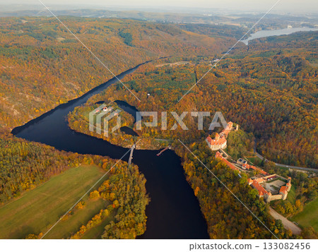 Beautiful autumn landscape with a castle from above from a drone. Beautiful Gothic castle Veveri. The city of Brno at the Brno dam. South Moravia Czech Republic Central Europe. 133082456