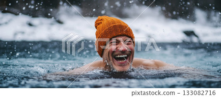 Man smiling while swimming in freezing winter lake 133082716