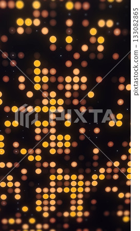 Vertical glowing halftone yellow and orange circle pattern. Warm luminous abstract background with elegant symmetry and digital light texture. 133082865