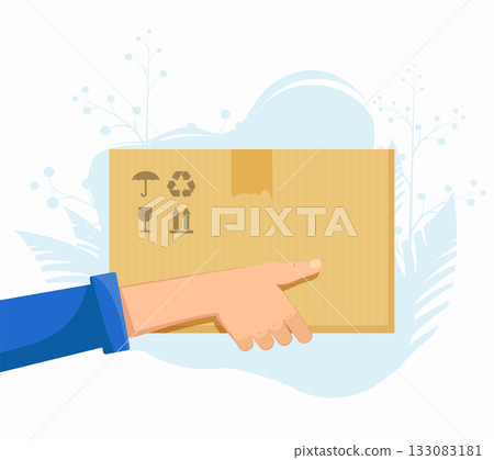 A male courier holds a cardboard box A male courier holds a cardboard box 133083181