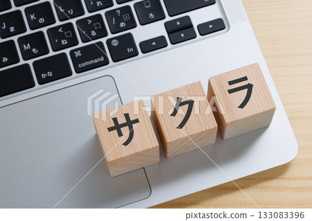 A block with the word "Sakura" written on it on top of a computer 133083396