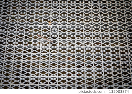 Galvanized metal grating surface for pedestrian walkway ramp or crossing providing drainage Galvanized metal grating surface for pedestrian walkway ramp or crossing providing drainage 133083874