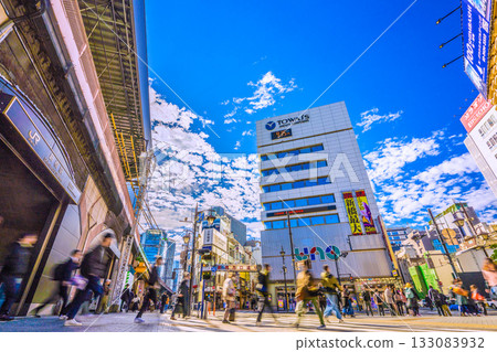 Tokyo cityscape in Japan: Commuting scene... Shimbashi Station, Karasumori Exit. Behind is Shimbashi West Exit Street. Let's move on to a new era = November 12th Tokyo cityscape in Japan: Commuting scene... Shimbashi Station, Karasumori Exit. Behind is Shimbashi West Exit Street. Let's move on to a new era = November 12th 133083932