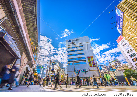 Tokyo cityscape in Japan: Commuting scene... Shimbashi Station, Karasumori Exit. Behind is Shimbashi West Exit Street. Let's move on to a new era = November 12th Tokyo cityscape in Japan: Commuting scene... Shimbashi Station, Karasumori Exit. Behind is Shimbashi West Exit Street. Let's move on to a new era = November 12th 133083952