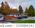 Autumn in residential area with a truck parked on uphil driveway Autumn in residential area with a truck parked on uphil driveway 133084141