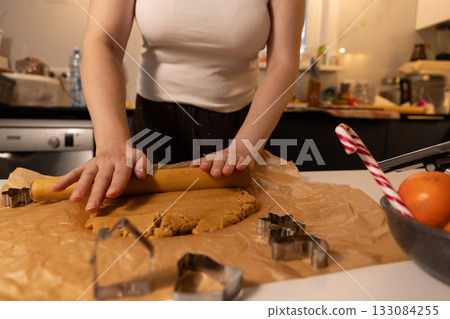 Gingerbread Preparation for Festive Celebration in Cozy Kitchen During Christmas Season Gingerbread Preparation for Festive Celebration in Cozy Kitchen During Christmas Season 133084255