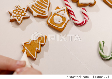 Decorating Gingerbread Cookies for a Festive Christmas Celebration Decorating Gingerbread Cookies for a Festive Christmas Celebration 133084271