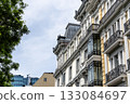 Elegant residential buildings in Castellana, Madrid, showcasing architectural details. 133084697
