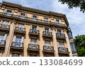 Elegant residential buildings in Castellana, Madrid, showcasing architectural details. 133084699