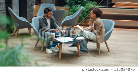 casual team planning setting, relaxed group discussion amid modern decor and natural illumination casual team planning setting, relaxed group discussion amid modern decor and natural illumination 133084870
