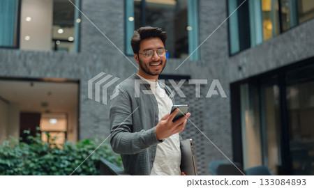 confident digital communicator, effective digital communicator exuding friendliness and competence 133084893