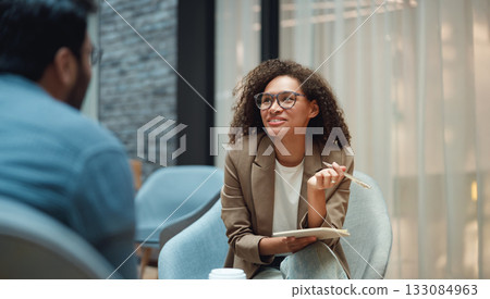 skilled mentor encourages client development by engaging attentively and demonstrating with gestures skilled mentor encourages client development by engaging attentively and demonstrating with gestures 133084963