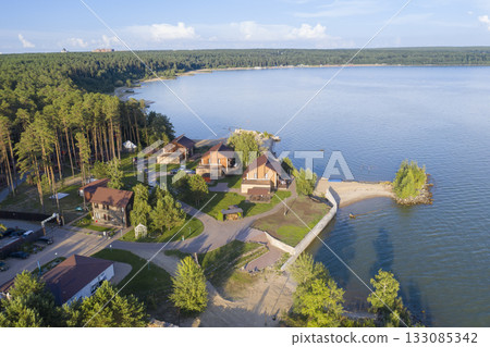 Aerial view of cottage village near the beach on the shore of the Ob Sea in Siberia in summer 133085342