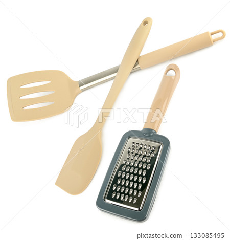 Modern Kitchen Utensils: Spatulas and Grater Isolated on White. Modern Kitchen Utensils: Spatulas and Grater Isolated on White. 133085495