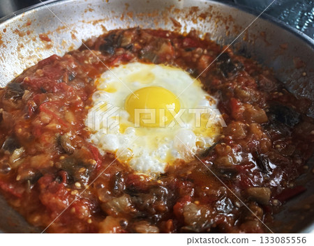 Shakshouka tunisian egg breakfast close up 133085556