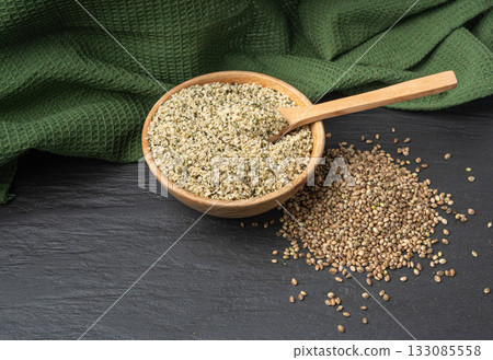 Shelled hemp seeds pile, peeled cannabis grains, marijuana kernels without peel 133085558