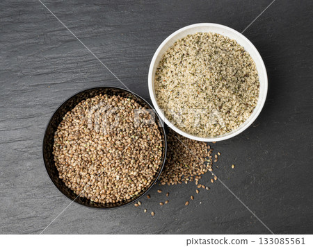 Shelled hemp seeds pile, peeled cannabis grains, marijuana kernels without peel 133085561