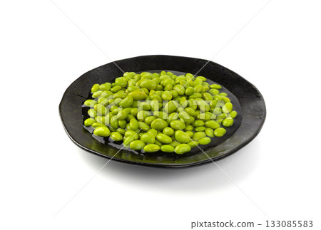 Edamame beans isolated. Green soy bean pile, cooked young soybean, boiled Japanese pea Edamame beans isolated. Green soy bean pile, cooked young soybean, boiled Japanese pea 133085583