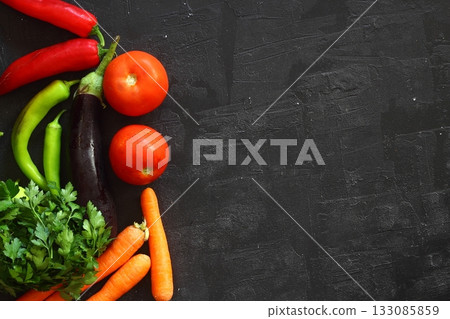 Isolated peppers and juicy cherry tomatoes. black backgorund. Isolated peppers and juicy cherry tomatoes. black backgorund. 133085859