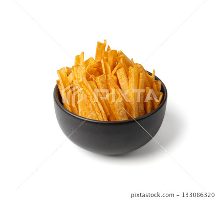 Fried chips sticks isolated, finger potato chips, golden shoestring fries pile, French fries 133086320