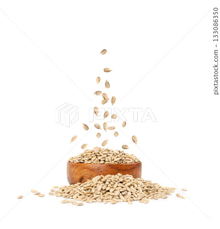Peeled Sunflower Seeds in Air Isolated, Raw Sunflower Kernels Fall in Pile Peeled Sunflower Seeds in Air Isolated, Raw Sunflower Kernels Fall in Pile 133086350