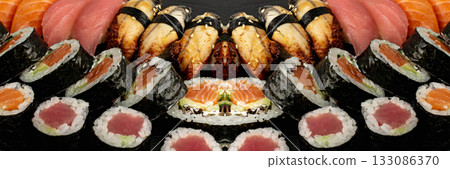 Set of Various Japanese Sushi Food on Dark Sate Plate Closeup. Nigiri and Nori Maki Sushi Rolls 133086370