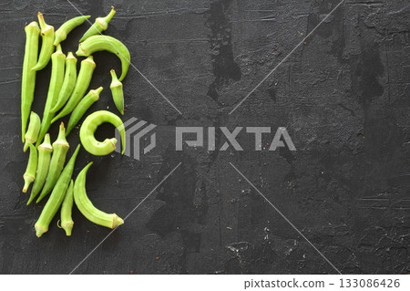 Fresh young okra or ladyfinger isolated on black background 133086426