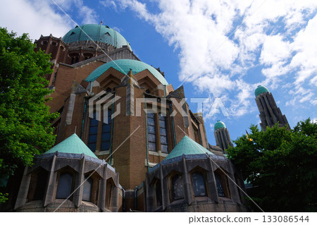 The National Basilica of the Sacred Heart, Sacre-Coeur, majestic dome, stone architecture, blue sky, Brussels, Belgium 133086544