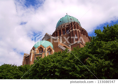 The National Basilica of the Sacred Heart, Sacre-Coeur, majestic dome, stone architecture, blue sky, Brussels, Belgium 133086547