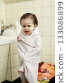 Little girl after bath wrapped in white towel 133086899