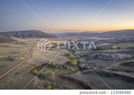 dusk over a valley in foothills of Rocky Mountains in Colorado in fall scenery 133086986