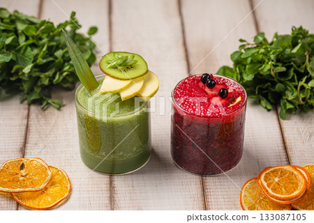 Green and berry smoothies in glasses Green and berry smoothies in glasses 133087105