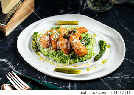 Green risotto with fried shrimp and asparagus Green risotto with fried shrimp and asparagus 133087116