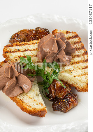 Isolated toast with liver pate and greens Isolated toast with liver pate and greens 133087117