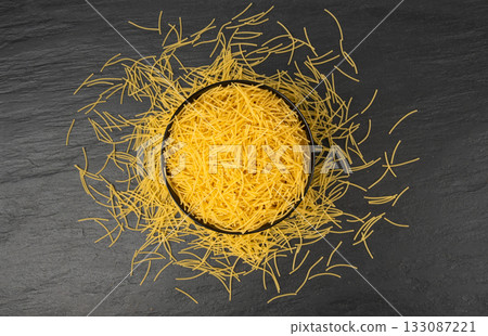 Raw vermicelli, gold soup pasta, small scattered homemade noodles, thin macaroni Raw vermicelli, gold soup pasta, small scattered homemade noodles, thin macaroni 133087221