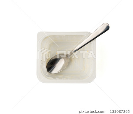 Empty yogurt cup isolated, yoghurt with orange fruits pieces in plastic pot, milk pudding container Empty yogurt cup isolated, yoghurt with orange fruits pieces in plastic pot, milk pudding container 133087265