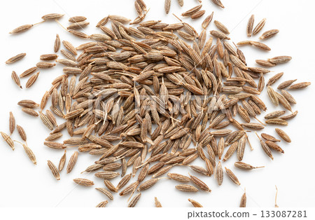 Cumin seed isolated. Caraway or fennel dry seeds close up, zeera macro, Indian cumin or zira grains 133087281