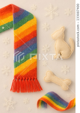 Cozy Winter Pride Flat Lay with Rainbow Scarf, Felt Dog, and Snowflakes 133087400