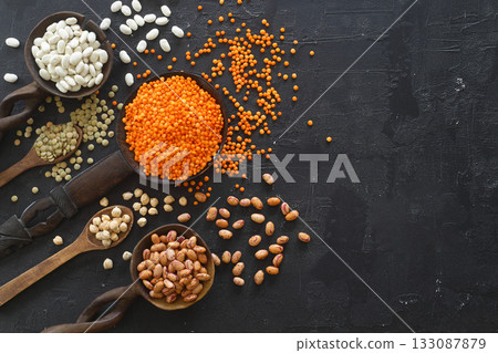 Different type of raw dry legumes composition. White beans, lentils, bulgur, chickpeas, kidney beans, corns, rice, Mix organic legume concept 133087879
